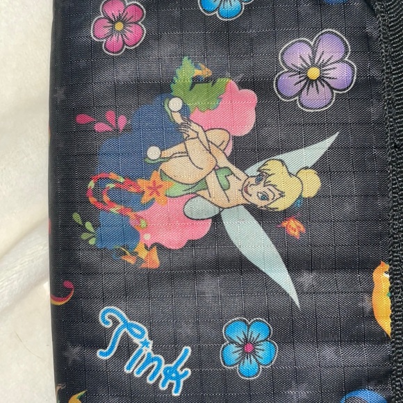 It’s a tinker bell wallet a broken button so not that much - Picture 2 of 4
